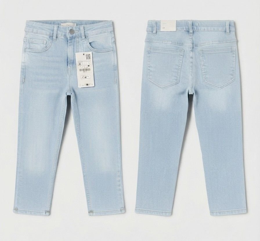 A pair of light blue denim jeans shown from both the front and back views, laid flat against a light gray background. The front view shows the waistband, belt loops, front pockets, and a hanging product tag.